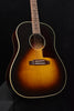 Sunburst acoustic guitar body with bridge, soundhole, and cream binding