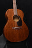 Martin acoustic guitar front view with sunburst body, soundhole, and bridge