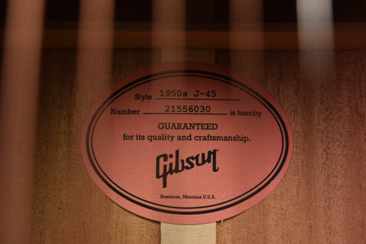 gibson label inside soundhole with text and serial number on wood