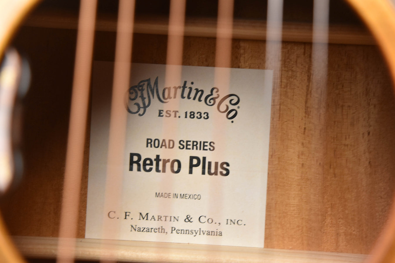 Retro Plus guitar label inside body: Road Series Retro Plus, Est. 1833