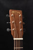 Martin acoustic guitar headstock with tuning pegs and engraved logo