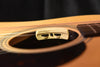 Anthem pickup control module on acoustic guitar top with VU-style indicators