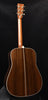 Acoustic guitar back with natural wood grain and center seam stripe