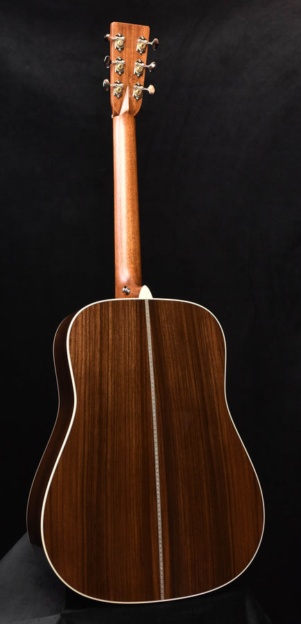 Acoustic guitar back with natural wood grain and center seam stripe