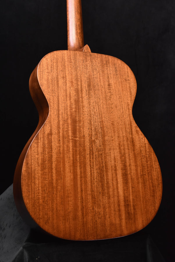 Martin acoustic guitar back close-up with textured wood grain