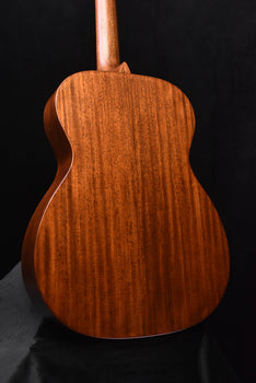 martin acoustic guitar back view with smooth wood grain and rounded shoulders