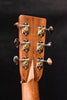 Acoustic guitar headstock with tuning machines and glossy wood texture finish