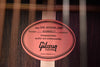 Guitar warranty stamp label on wooden soundboard