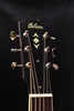 Gibson headstock with ornate tuning machines and diamond inlay logo