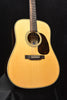 Signature dreadnought acoustic guitar with natural finish top, black pickguard, soundhole