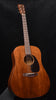Brown dreadnought acoustic guitar body with black pickguard and round sound hole
