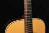 Signature dreadnought acoustic guitar neck close-up with dot inlays and fretboard