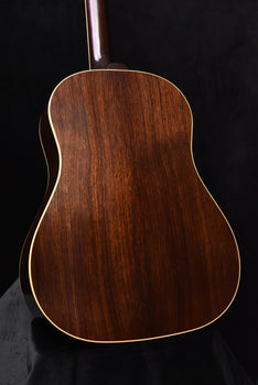 acoustic guitar back close-up with wood grain and gold binding outline