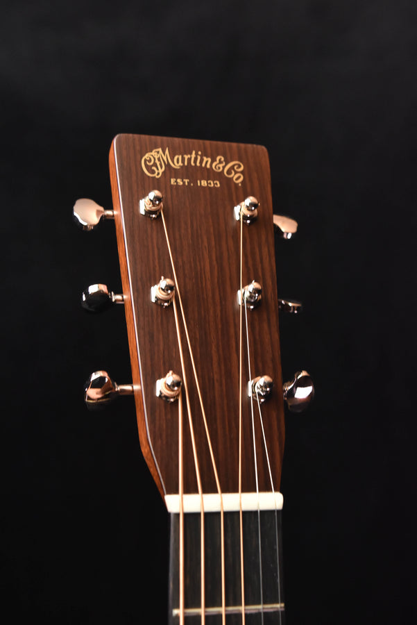 Martin headstock on a signature acoustic guitar with tuning pegs and logo