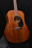 Brown dreadnought acoustic guitar front with black pickguard and circular sound hole