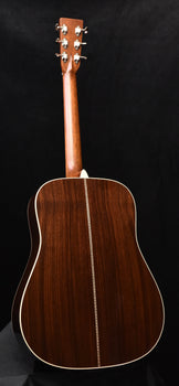 signature dreadnought acoustic guitar back view with dark wood and cream binding