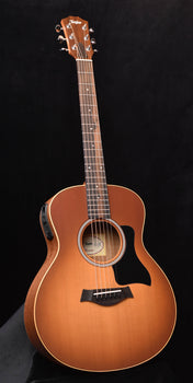 taylor gs mini-e honeyburst acoustic-electric guitar, front view with sound hole and bridge