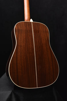 signature dreadnought acoustic guitar back view with center seam and cream outline