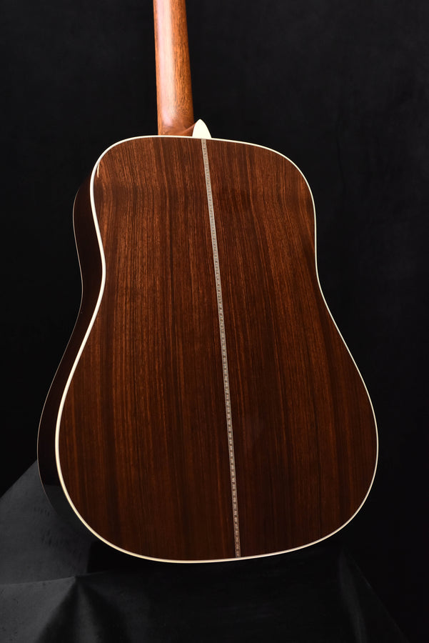 Signature dreadnought acoustic guitar back view with center seam and cream outline