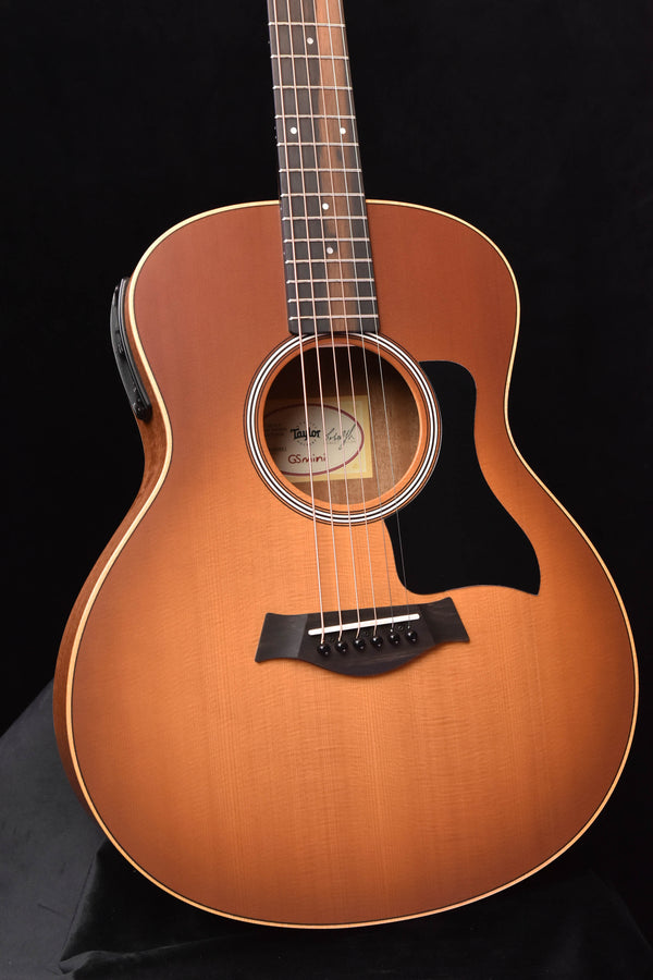 Taylor GS Mini-e Honeyburst acoustic-electric guitar, close-up of sound hole and pickguard