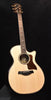 Natural acoustic guitar with black pickguard and rosewood-style fretboard.