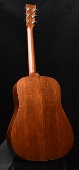 brown acoustic guitar back with smooth finish and curved body shape