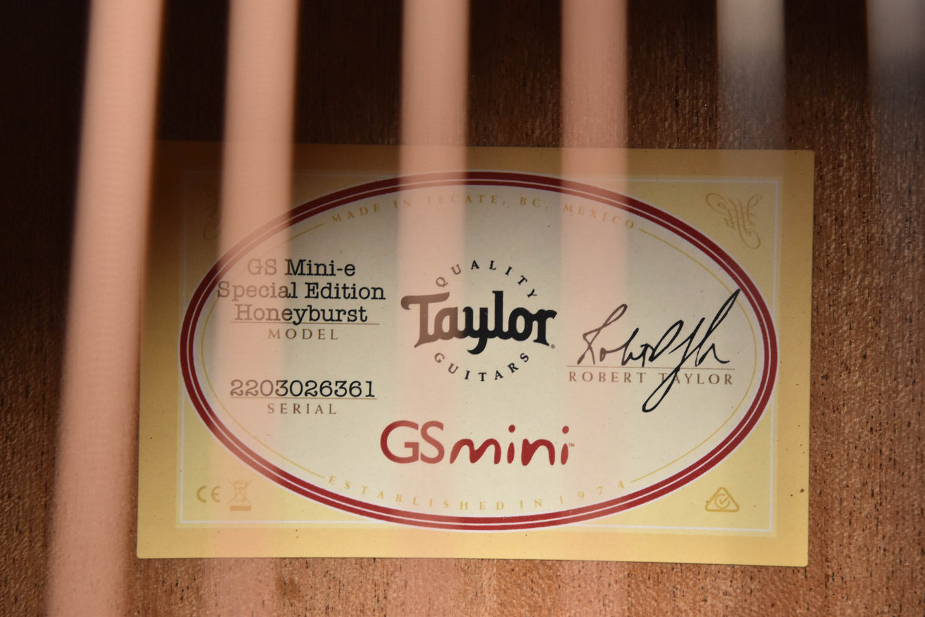 Honeyburst guitar serial/model label on the body
