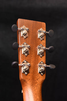 acoustic guitar headstock with six tuning machines and chrome tuning buttons