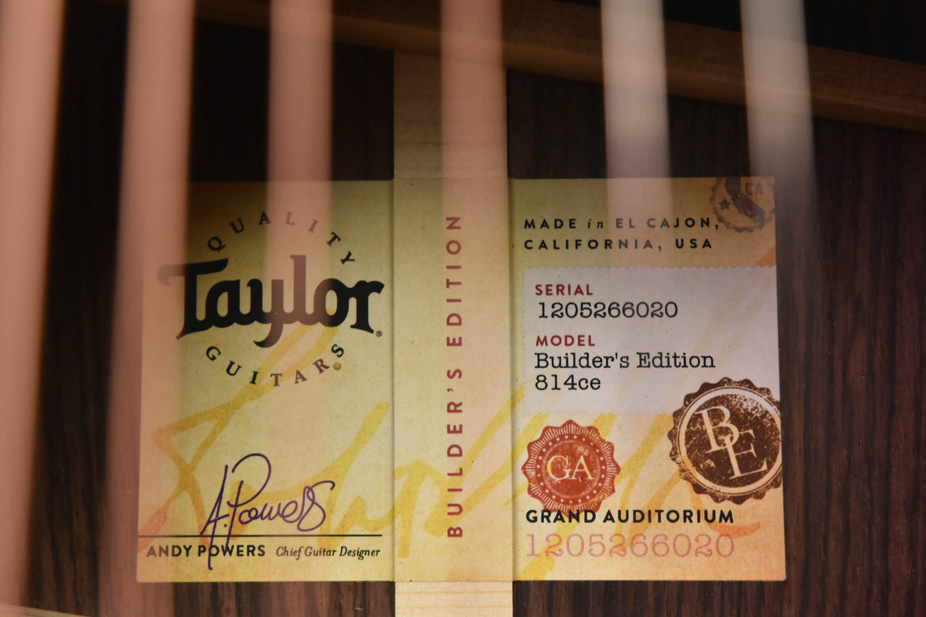 Taylor guitar back labels with model text including 814ce Builder's Edition.