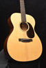 Martin acoustic guitar front view with rosette sound hole and bridge on light top