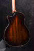 Dark sunburst acoustic guitar back with binding and subtle center seam line.
