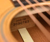 Acoustic guitar neck block with stamped model and serial numbers on wood