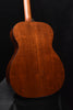 Martin acoustic guitar back view with warm brown figured wood finish