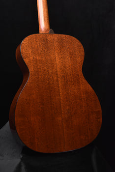 martin acoustic guitar back view with warm brown figured wood finish