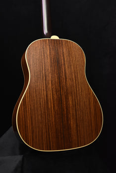 gibson acoustic guitar back close-up with natural wood grain and side binding
