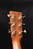Martin acoustic guitar headstock with six tuning machines and circular knobs