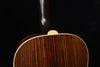 Gibson acoustic guitar top back edge close-up with wooden finish and binding