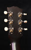 Gibson acoustic guitar headstock back with six tuning pegs and engraved tuner plates