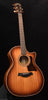 Taylor acoustic guitar with amber sunburst finish and black pickguard