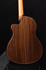 Cutaway classical guitar side view with dark striped wood top and curved body