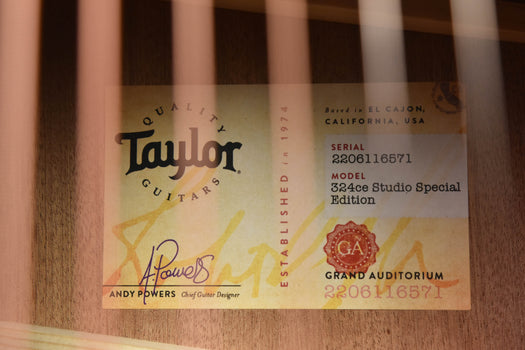 taylor guitar label on soundboard with serial and model text