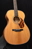 Acoustic guitar front view with natural finish and tortoise-look pickguard