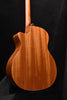 Taylor acoustic guitar back close-up with natural wood grain finish