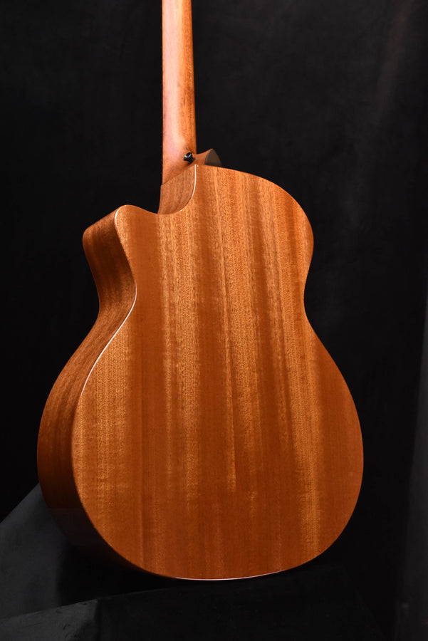 Taylor acoustic guitar back close-up with natural wood grain finish