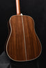 Brown acoustic guitar back with vertical grain pattern and white binding