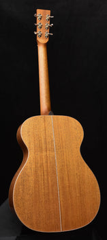 acoustic guitar back view with natural wood finish and center seam