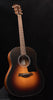Sunburst acoustic guitar with Taylor headstock and round sound hole