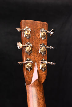 martin & co acoustic guitar headstock with six tuning pegs and floral inlay
