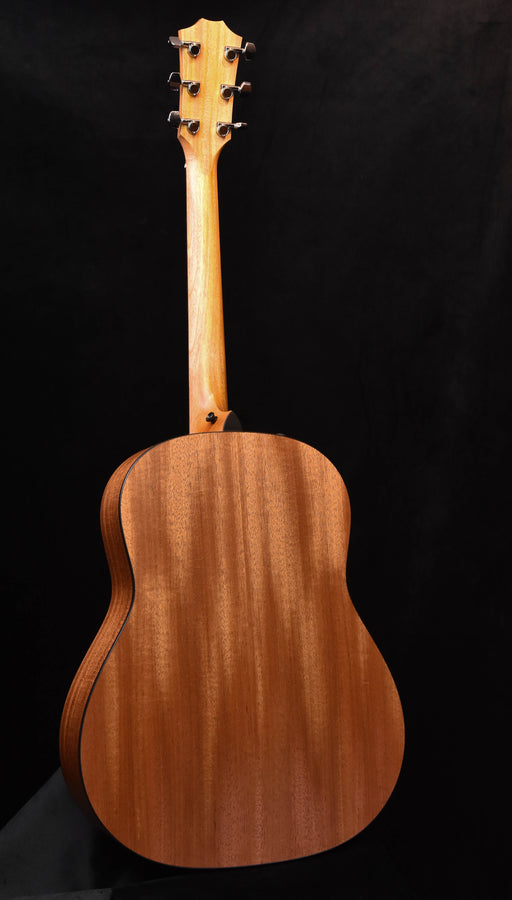 Acoustic guitar back with natural wood finish and subtle edge binding