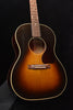 Acoustic guitar front view with sunburst body, sound hole rosette, and pickguard